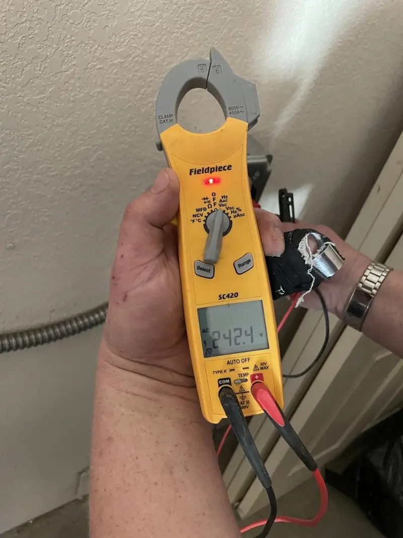 Voltage testing with clamp meter during Outlet Installation in Utica